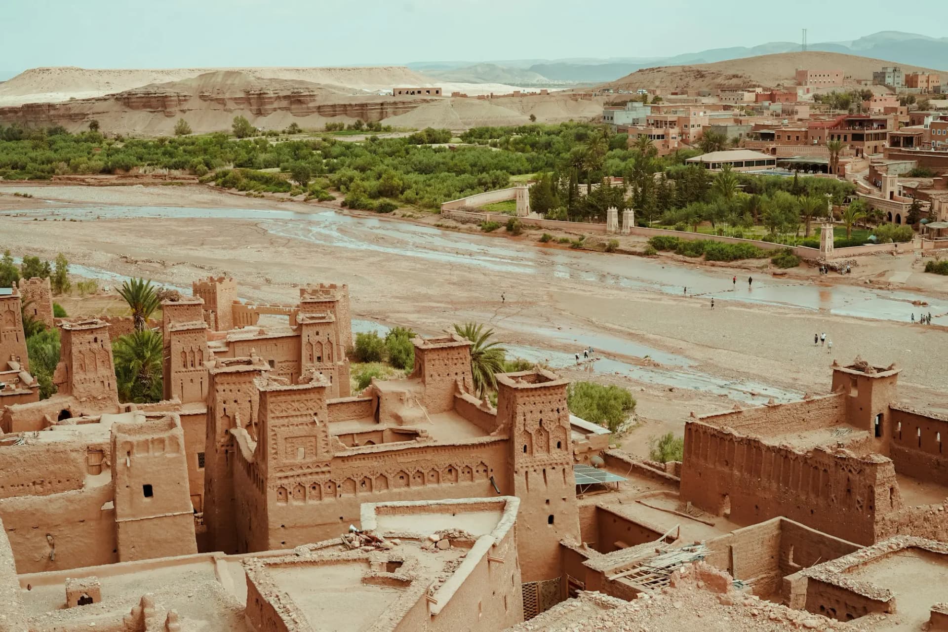 Earthen towers of Ait Ben Haddou above a riverbed in southern Morocco